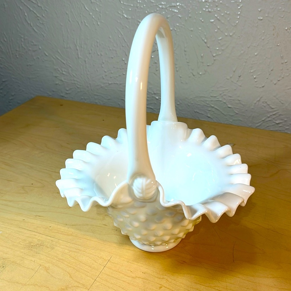 Vintage white milk glass hobnail basket with ruffled edges.